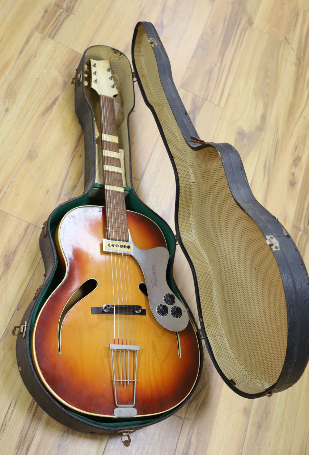 A 1950s possibly Isana semi-acoustic arch top guitar with a hard case. Floating pick-up not an original feature.